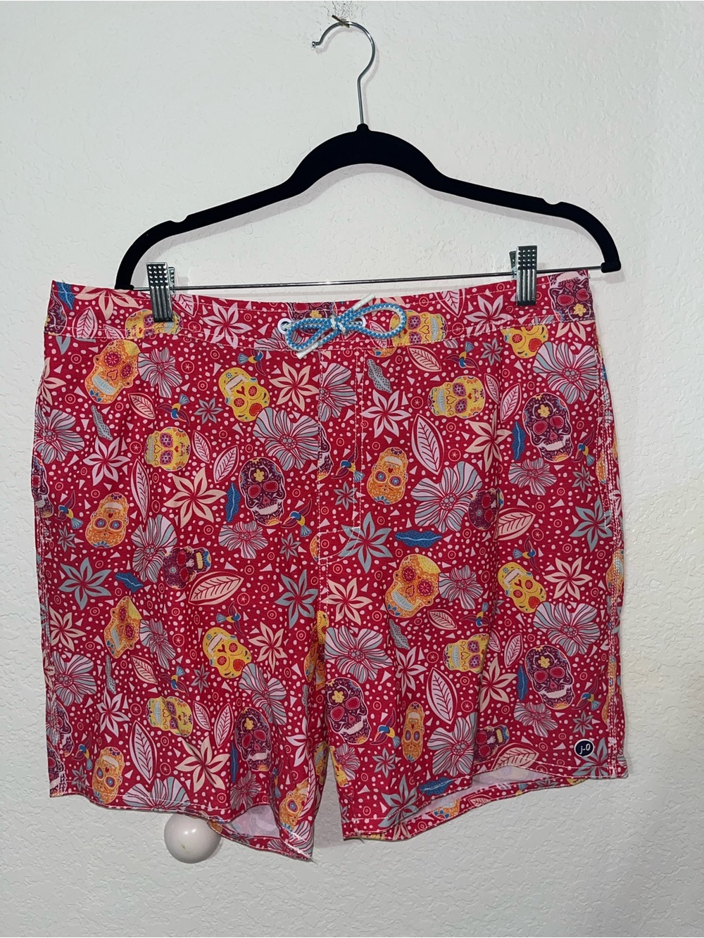 Johnnie-O red skull patterned swim trunks
